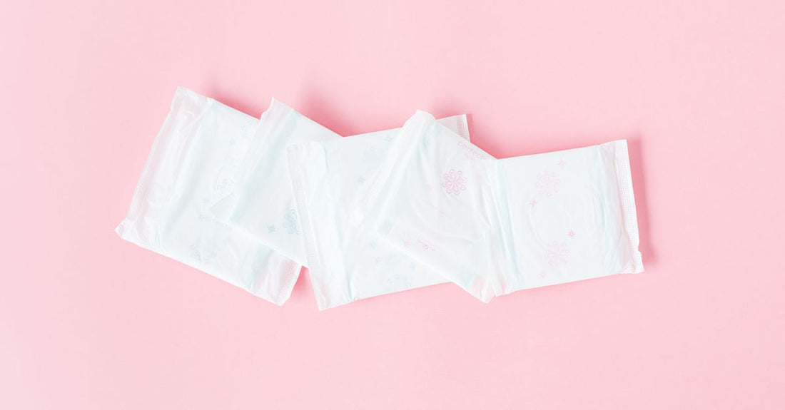 Cotton pads and rounds flatlay on a clean surface for a buying guide article.