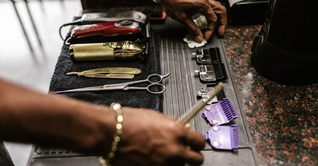 Close-up of various trimmer and clipper blades on a neutral background for a UK buying guide.