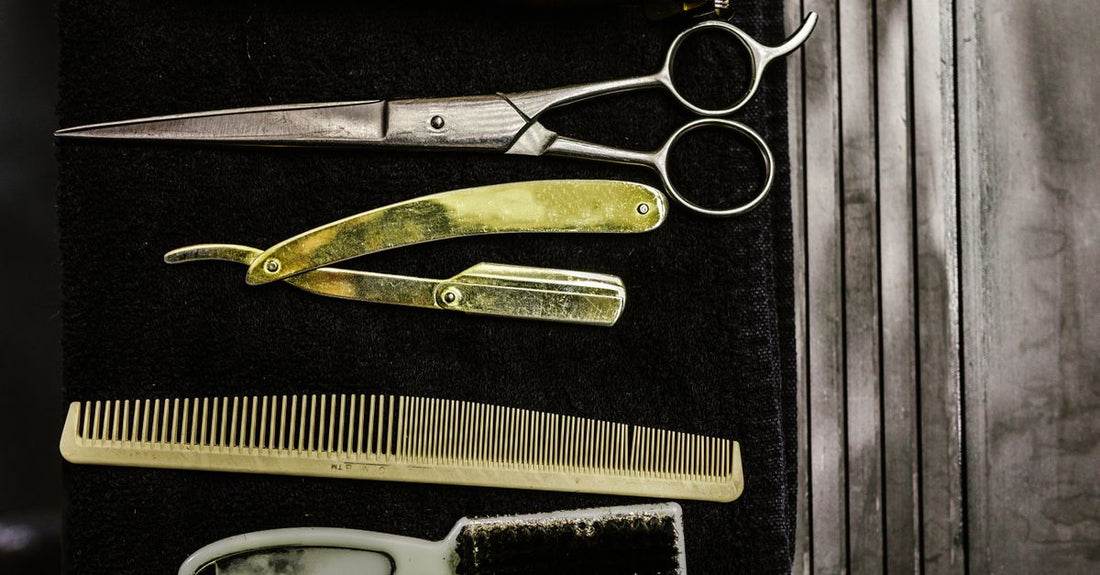 A set of wooden and carbon fibre hair combs laid out neatly on a white surface, illustrating a hair combs buying guide for breakage-free styling.