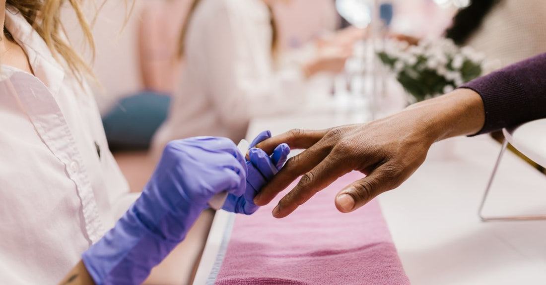 A modern, compact electric nail dryer device photographed in a clean studio setting, representing the best nail dryers UK 2026.