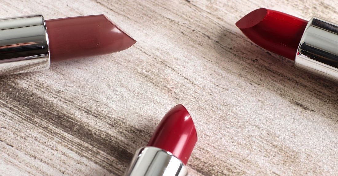 Assorted lipstick tubes in a flatlay arrangement, illustrating a lipstick buying guide for UK shoppers.