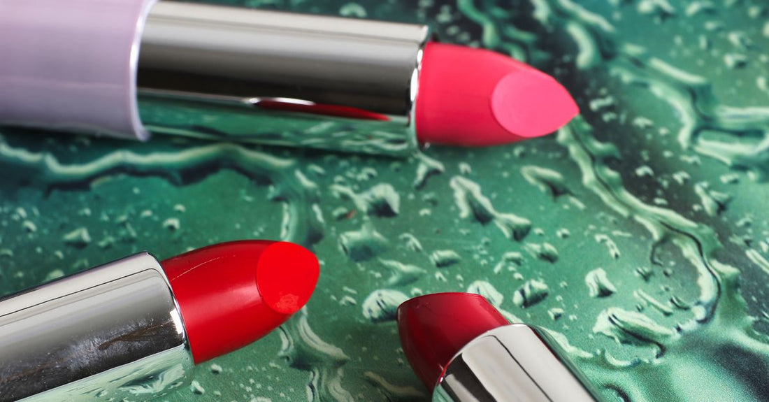A collection of lipstick tubes in various shades on a white marble surface, illustrating the search for the best lipstick for fair skin UK.
