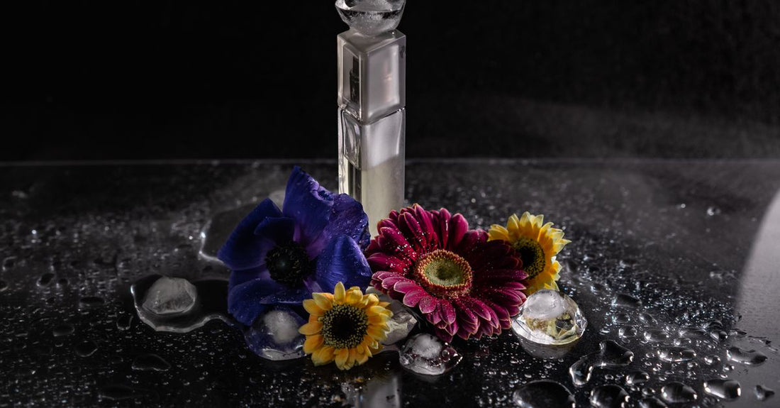 A flatlay of colourful body spray bottles on a neutral background, demonstrating how to choose body sprays by comparing packaging and scent families.