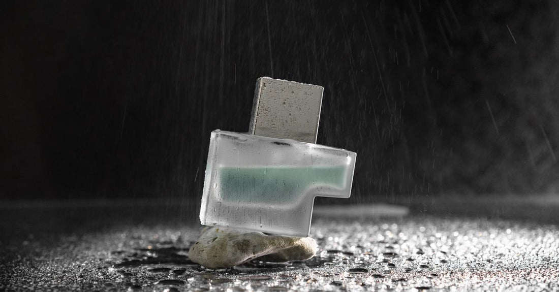 Best eau de parfum 2026 glass bottle on a light marble surface with soft shadows, representing luxury UK fragrance choices