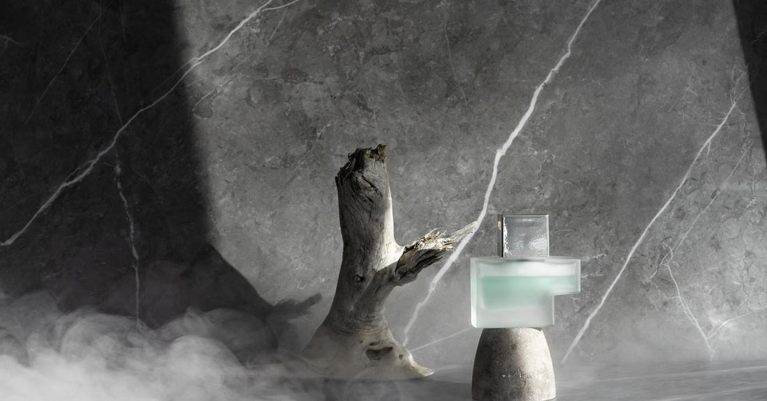 A hair styling mousse bottle on a white marble surface, illustrating how to choose mousses UK for defined curls.