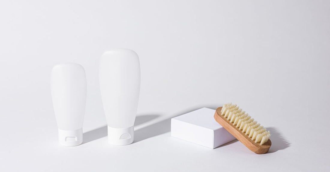 A selection of the best 2-in-1 shampoo & conditioner 2026 bottles arranged on a clean bathroom shelf.
