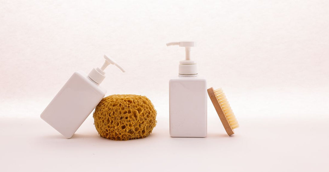A row of body wash bottles on a bathroom shelf illustrating how to choose body washes UK
