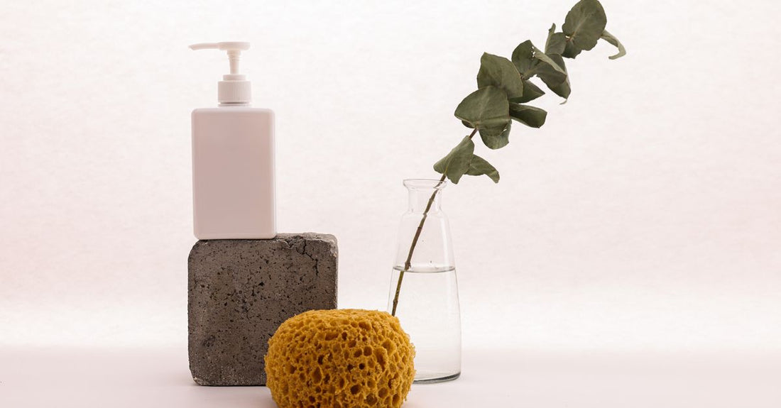A self-tanner bottle on a marble surface, representing how to apply self tanner without streaks for a flawless, sunless glow.