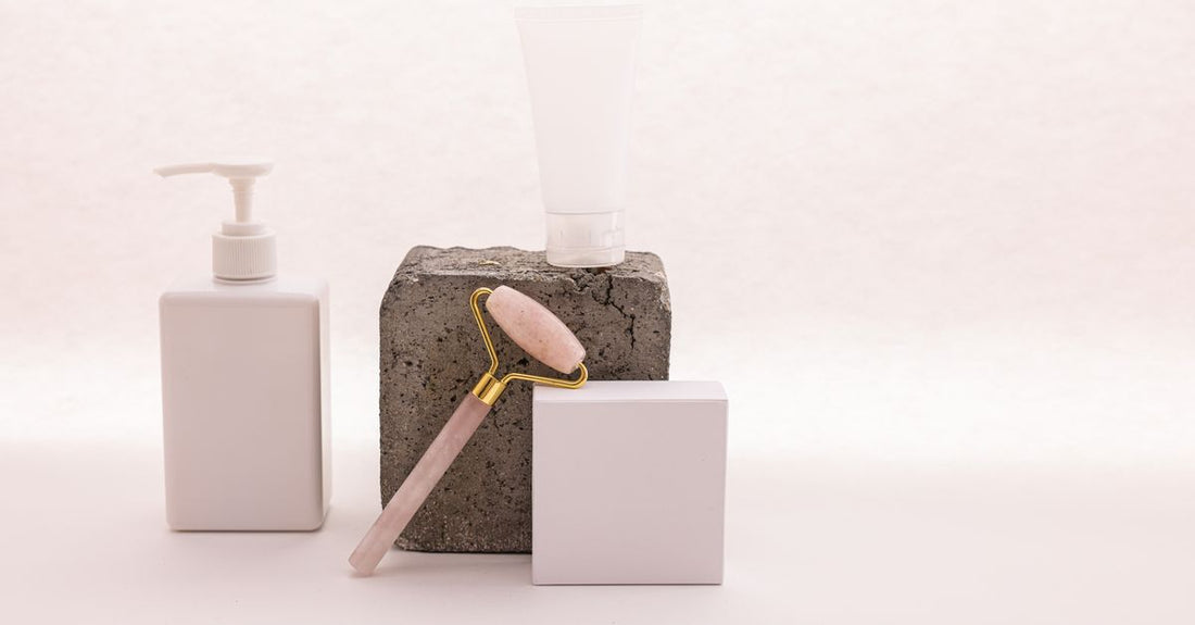 Best facial kits 2026: A curated flatlay of premium skincare products including serums, moisturisers, and cleansers on a marble surface.