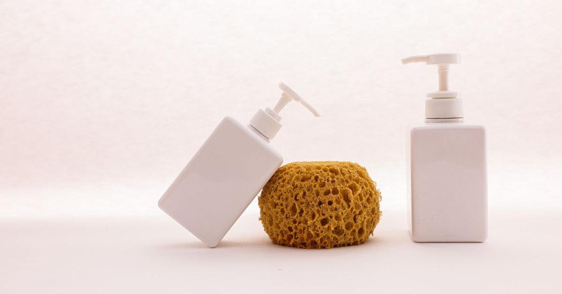 Three bottles of best body wash for dry skin UK, arranged on a marble surface with soft natural light highlighting their hydrating formulas.