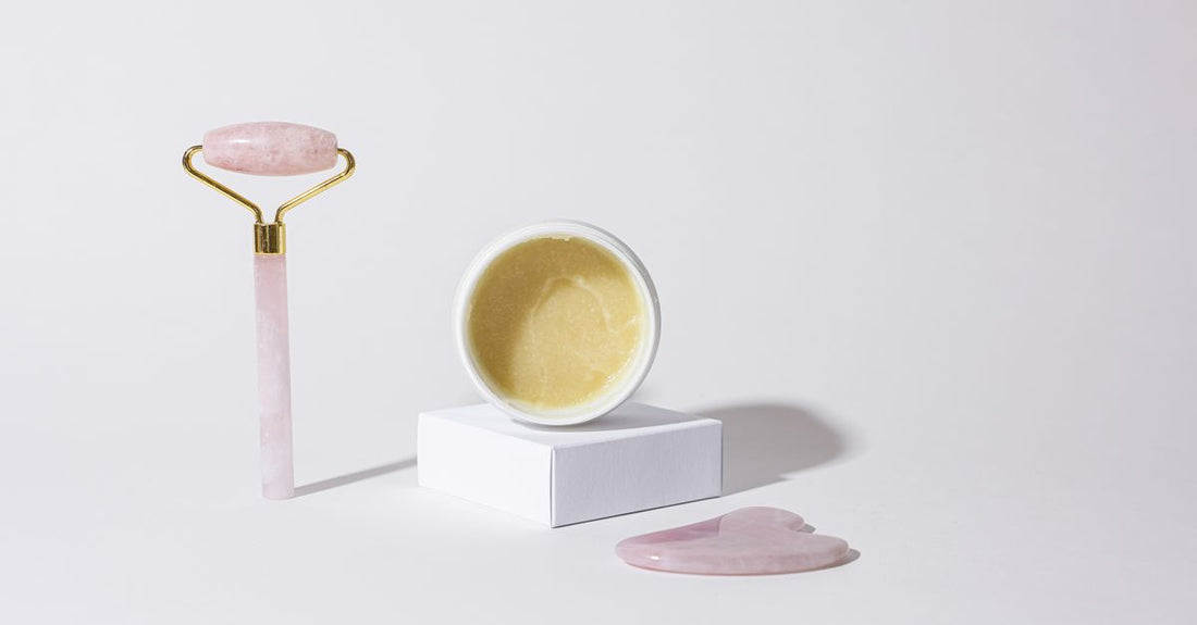 A flatlay of aftercare products including soothing balm, cleansing spray and healing ointment, showing how to choose aftercare products for optimal skin recovery.