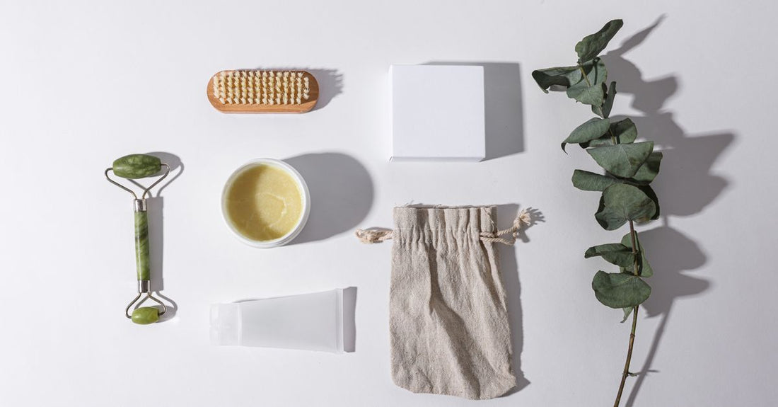 A stainless-steel callus remover tool and foot file on a bathroom shelf, illustrating a corn & callus trimmers buying guide.