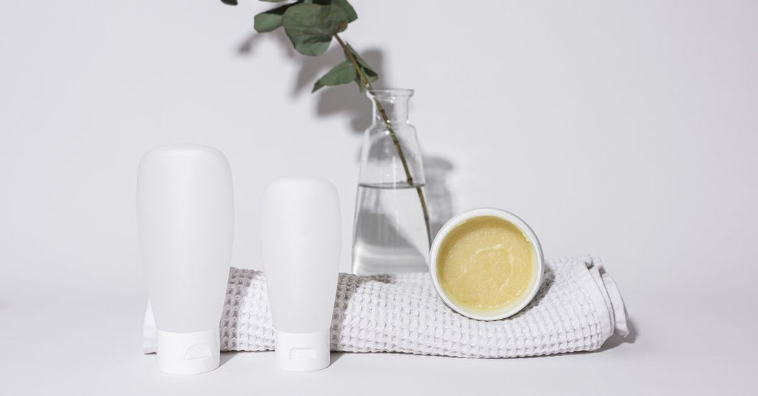 A selection of the best shampoo for hair growth UK displayed on a bathroom shelf, featuring caffeine and biotin formulations.