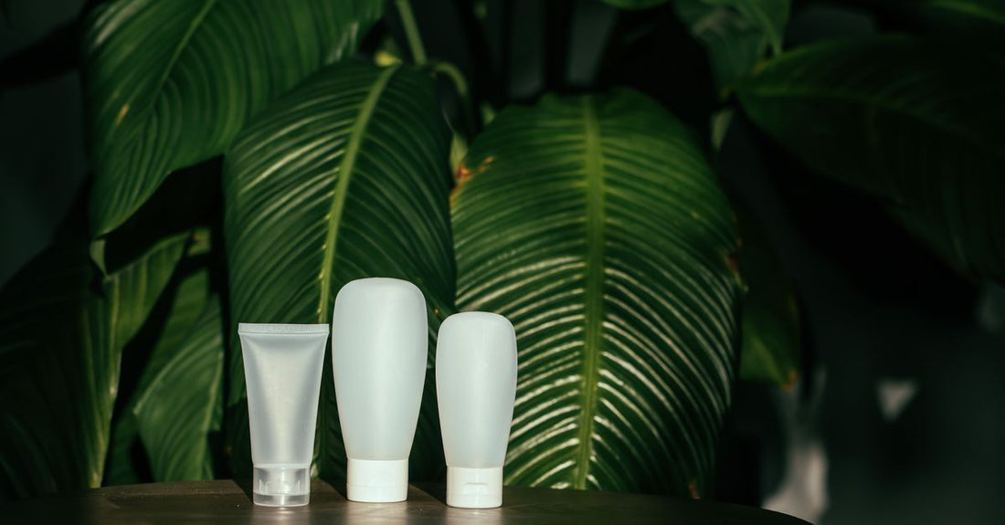 Flat lay of organic skincare products on a light marble surface, representing a complete organic skincare routine.