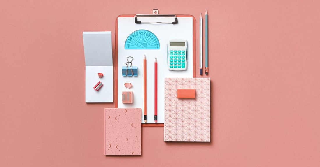 A flatlay of a complete makeup brush set with synthetic bristles, showcasing foundation, powder, and eyeshadow brushes on a marble surface.