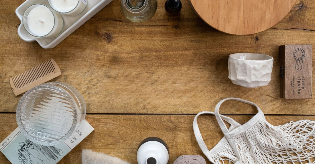 A flatlay of a hair relaxing kit with gloves, neutralising shampoo, and a relaxer cream jar on a white background, showing how to relax hair at home safely.