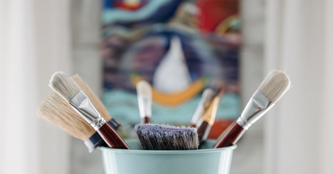 A flatlay of five durable nail art brush sets with fine liners and dotting tools on a white background, illustrating a nail art brushes buying guide.