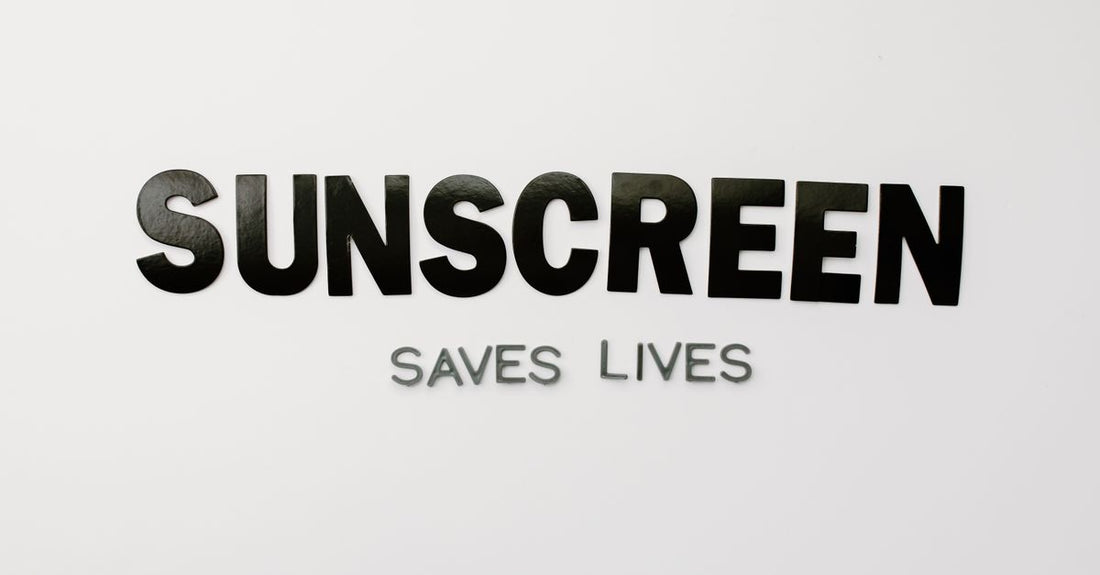 A collection of facial sunscreen bottles and tubes on a clean white surface, illustrating a facial sunscreens buying guide UK.