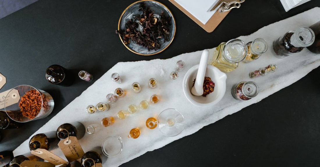A collection of the best body sprays 2026 arranged on a dressing table, showcasing different bottle designs and scents available in the UK.