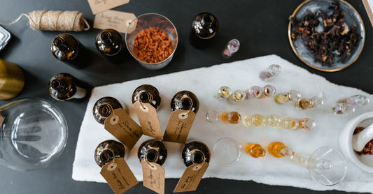 A selection of elegant perfume bottles on a marble surface, representing the best perfume for women UK 2026.
