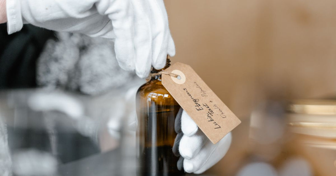 A laboratory display of lotion ingredients with molecular models and botanical extracts, illustrating how to choose lotions based on scientific formulation.