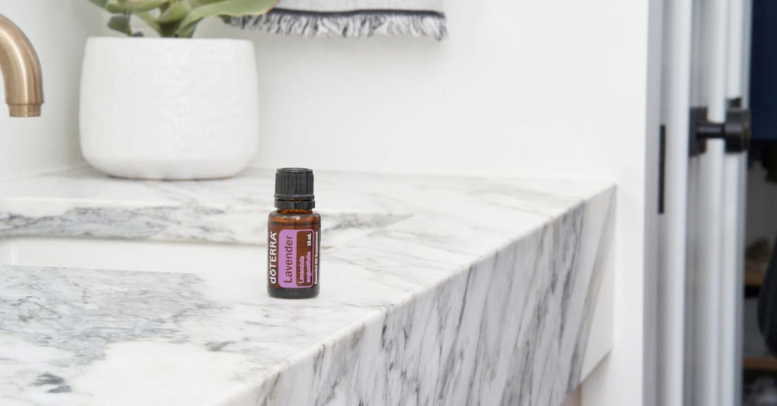 A cleansing oil and foaming cleanser positioned on a marble surface, illustrating the two-step method for how to double cleanse for clear skin.