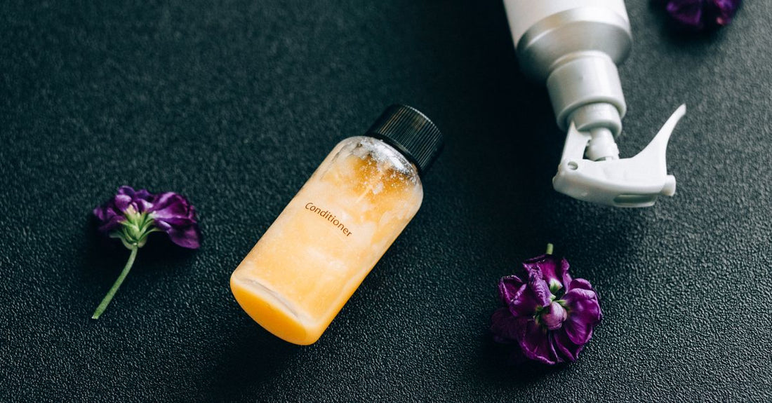 Conditioner bottle on a white shelf representing how to use conditioner for best results
