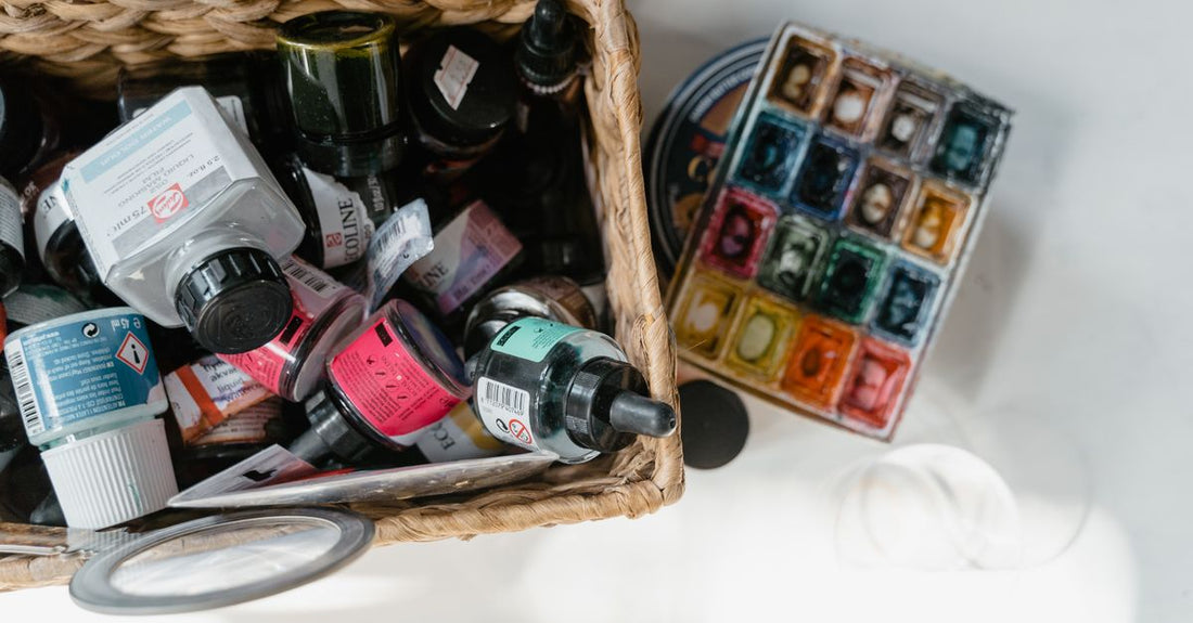 Best hair color for grey coverage UK – home dye boxes on a bathroom shelf with a colour chart.
