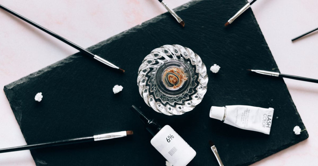 Flatlay of assorted hair brushes on a white surface, demonstrating how to choose hair brushes UK