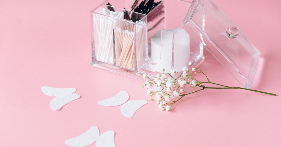 Pure cotton balls and round pads arranged on a marble surface, illustrating the best cotton UK 2026 for beauty routines.