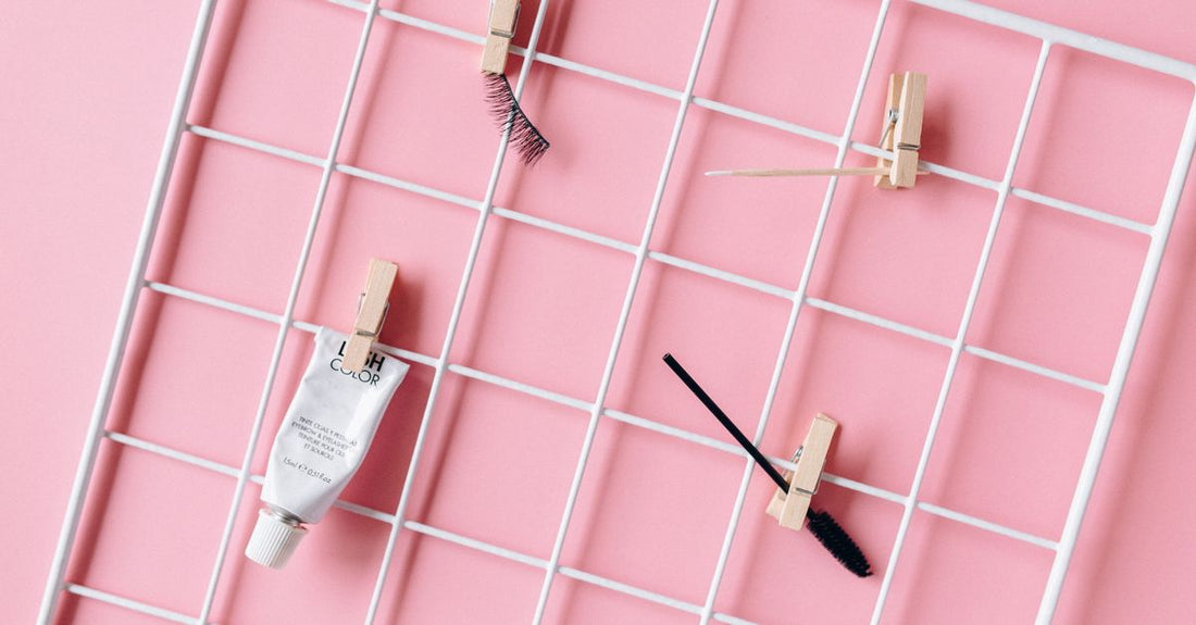 False eyelashes buying guide UK: various lash styles neatly arranged on a light surface, showing different lengths and volumes.