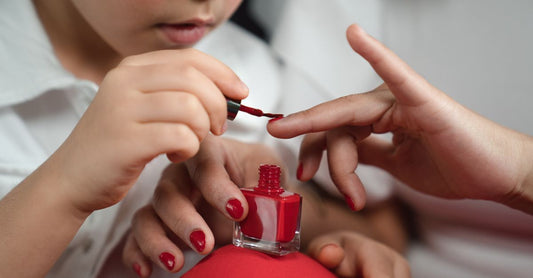 A flatlay of colourful nail polish bottles arranged on a marble surface, representing the best nail polish 2026 selection.