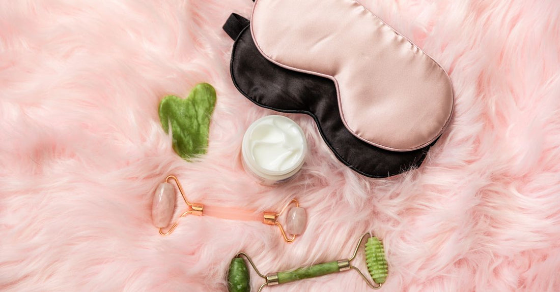 A sleeping mask jar on a flatlay with skincare tools, illustrating how to choose sleeping masks UK.