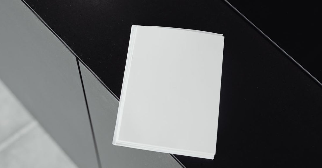 A stack of best blotting paper 2026 sheets in a sleek dispenser box, ready to absorb excess oil for a matte, shine-free complexion.