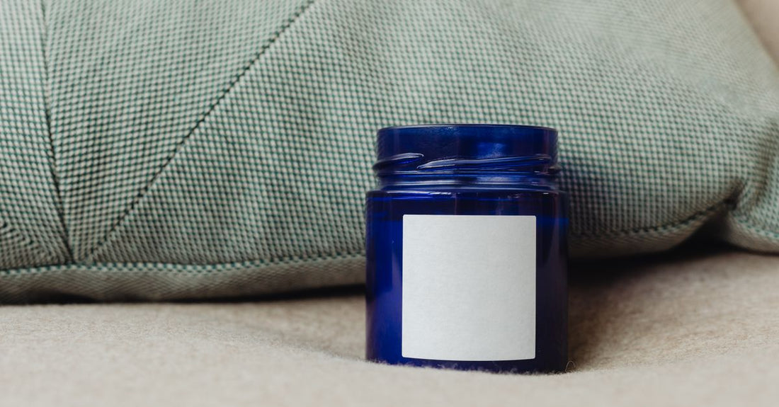A white jar of moisturising balm on a clean white background, illustrating the balms buying guide for UK shoppers comparing price and quality.