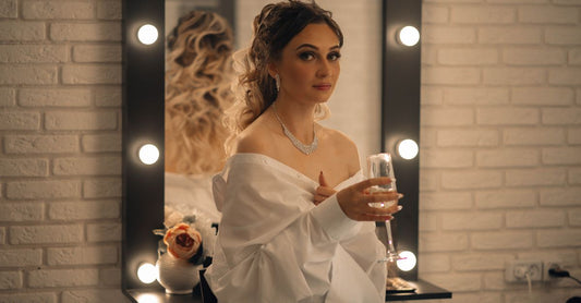 A sleek lighted makeup mirror on a modern vanity table, illustrating how to choose makeup mirrors with good light and magnification.