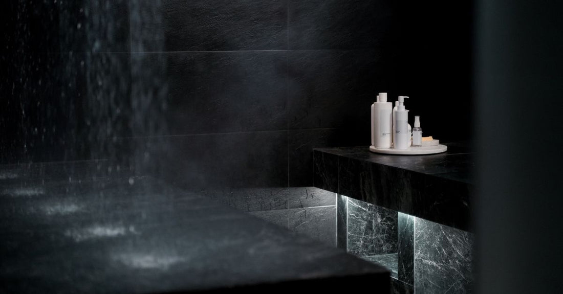 A sleek face mist bottle on a marble surface, representing a face mists buying guide UK