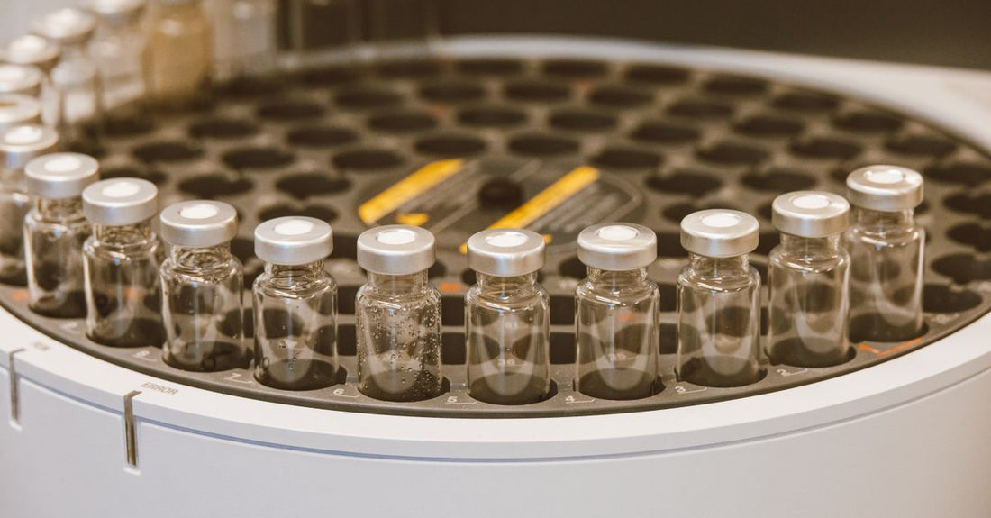 A clear skincare gel in a laboratory beaker undergoing ingredient concentration analysis, illustrating the gels buying guide focus on active ingredient value.