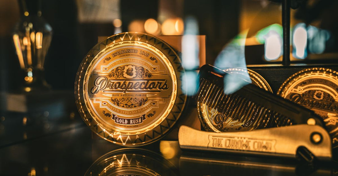 A collection of pomade jars on a white surface, illustrating how to choose pomades UK for different hair types.