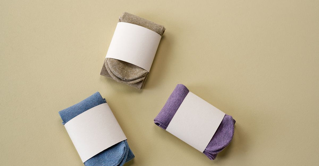 Pair of moisturising foot mask socks on a clean surface, showing how to use foot mask for soft feet