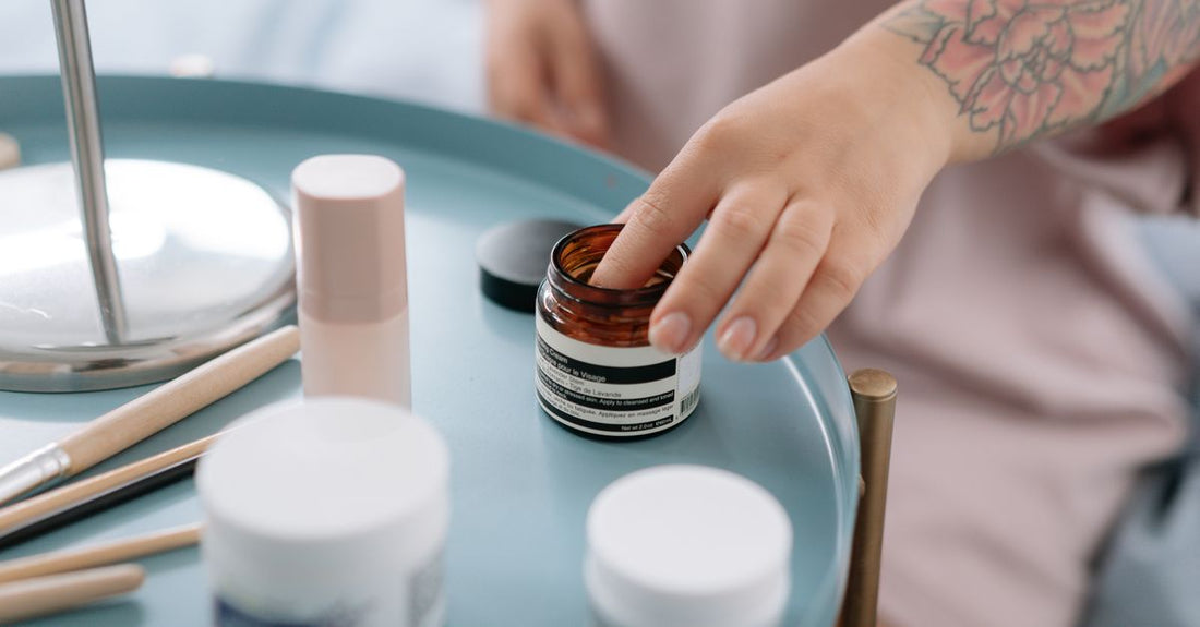 A selection of UK face creams and moisturiser jars on a light surface, illustrating how to choose creams UK.