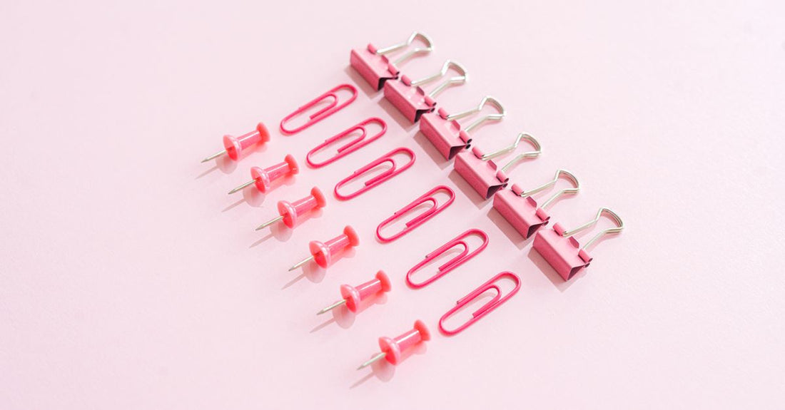A selection of durable hair clips laid out on a neutral background, representing the best clips 2026 for damage-free styling.