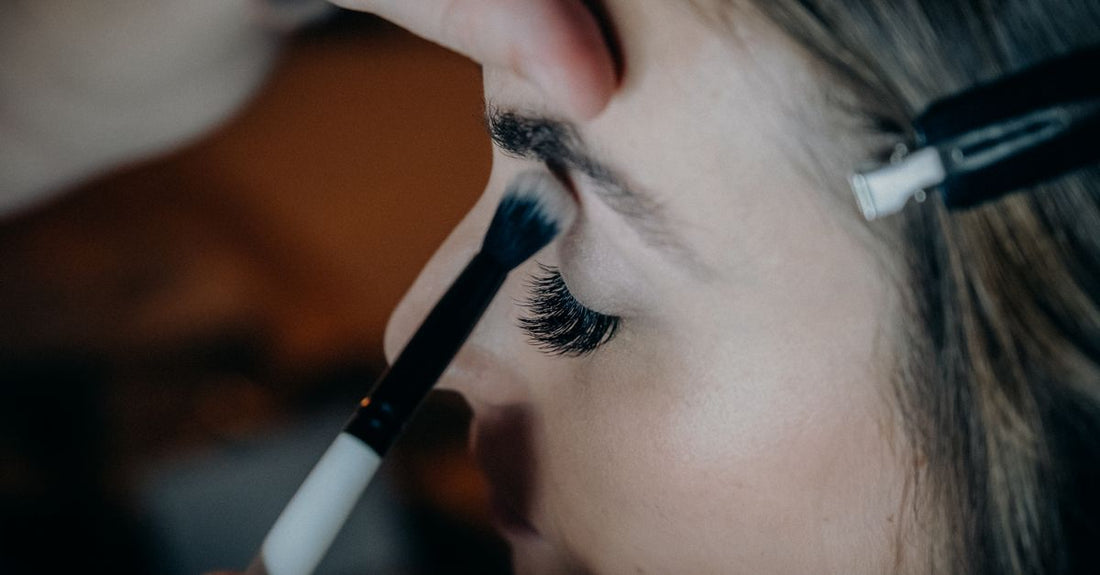 Three different eyelash curler shapes laid on a white surface, demonstrating how to choose eyelash curlers for UK shoppers.