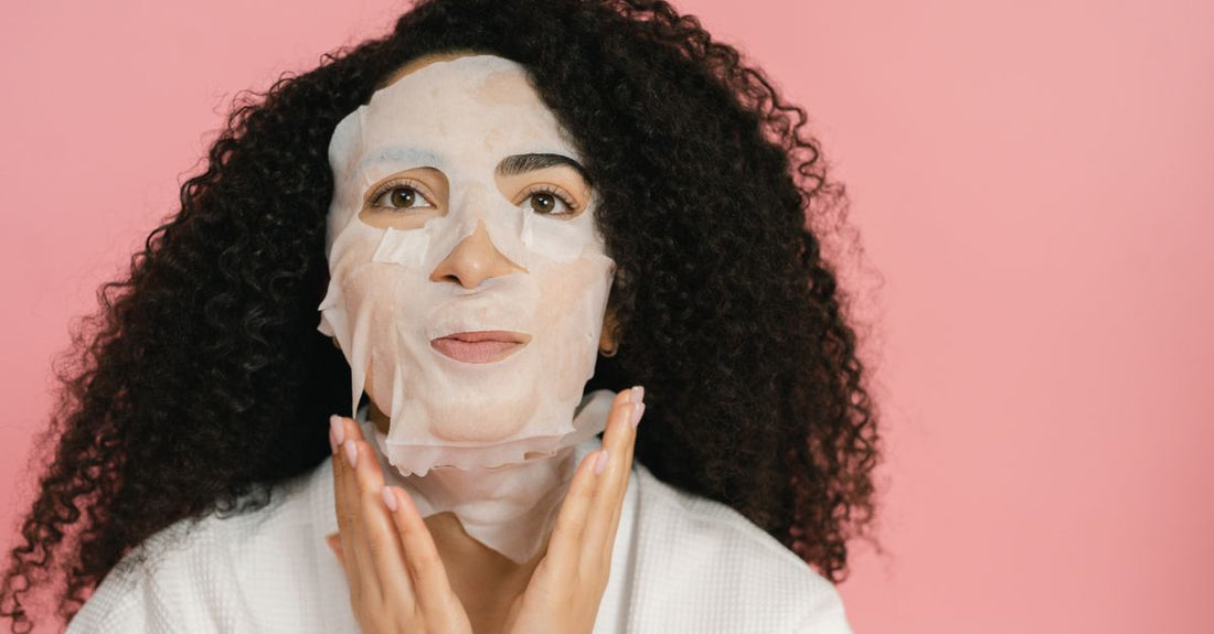 A flatlay of five different face mask jars and tubes against a clean background, representing the best masks 2026 selection.