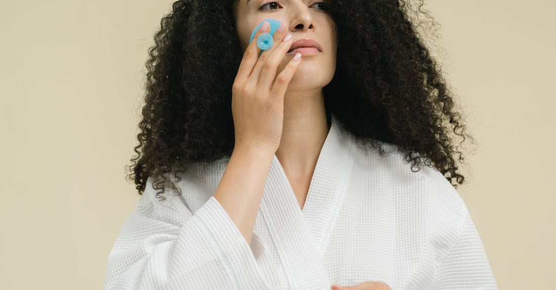 A collection of different hair rollers including velcro, heated, and foam types on a white background, illustrating how to choose hair rollers for various hair types.