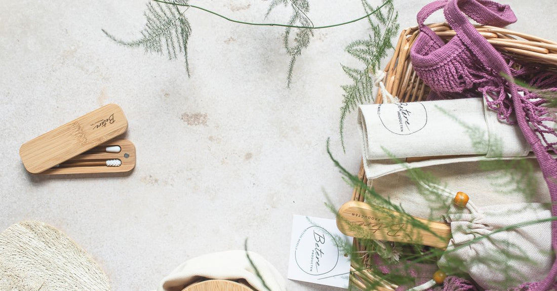 A flatlay of best hair care UK 2026 essentials including a hair oil, shampoo, and scalp serum on a marble surface.