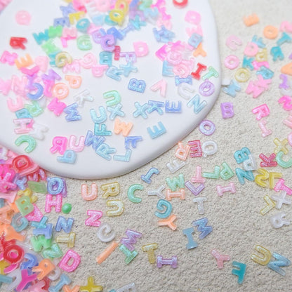 ROFIBUT Letter Nail Art Charms - Random Candy Color Letter Resin Nail Rhinestones, Kawaii Summer Flatback Alphabet Nail Gems with Glitter Design, DIY Craft Nail Supplies 250Pcs