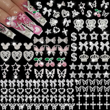 KACHIMOO 106 Pcs Nail Charms and Gems - Silver Nail Rhinestones 3D Butterfly, Bow, Star, Cherry, Cross, Dollar, Heart Shapes for Acrylic Nails (19 Styles)