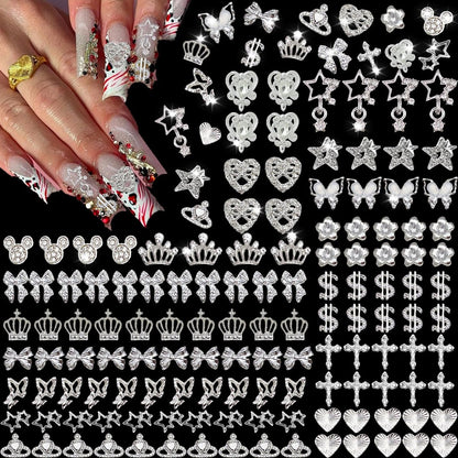 KACHIMOO 128 PCS Silver Nail Charms - 3D Butterfly, Bow, Star, Crown, Cross, Dollar, Heart Shapes - Y2K Nail Art Rhinestone Decor Avelisse