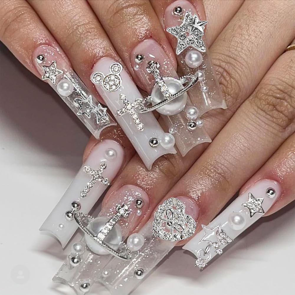 KACHIMOO 128 PCS Silver Nail Charms - 3D Butterfly, Bow, Star, Crown, Cross, Dollar, Heart Shapes - Y2K Nail Art Rhinestone Decor Avelisse